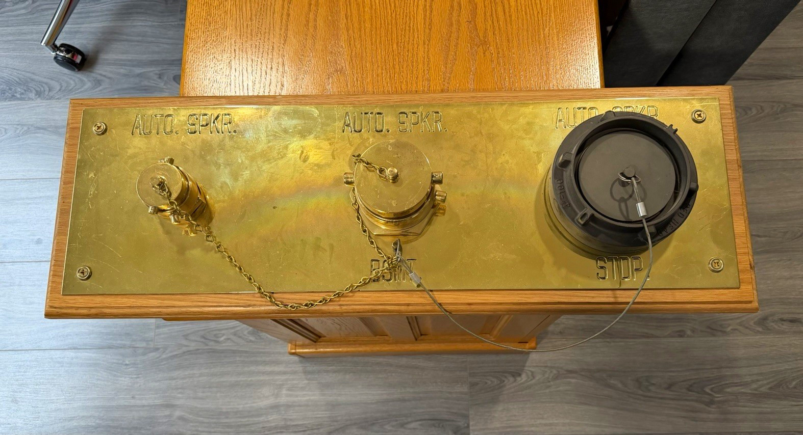 Automatic Sprinkler Fire Department Connection (FDC). The brass plate and chain Automatic Sprinkler Fire Department Connection (FDC). The brass plate and chain