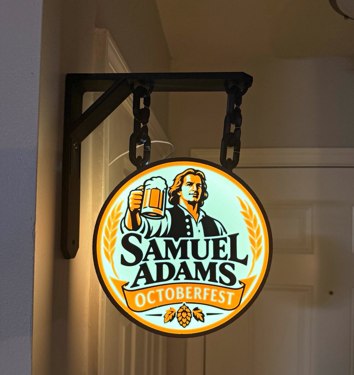 Samuel Adams Oktoberfest Lighted Round Hanging Beer Sign w/ Wall Mount & Chains Samuel Adams Oktoberfest Lighted Round Hanging Beer Sign w/ Wall Mount & Chains