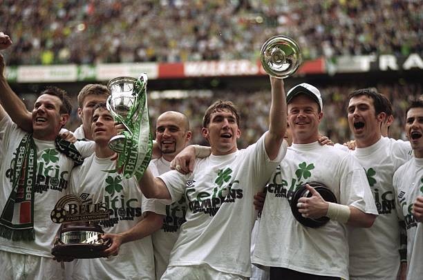 Celtic players celebrate after a Scottish Premier League match v S- Old Photo Celtic players celebrate after a Scottish Premier League match v S- Old Photo