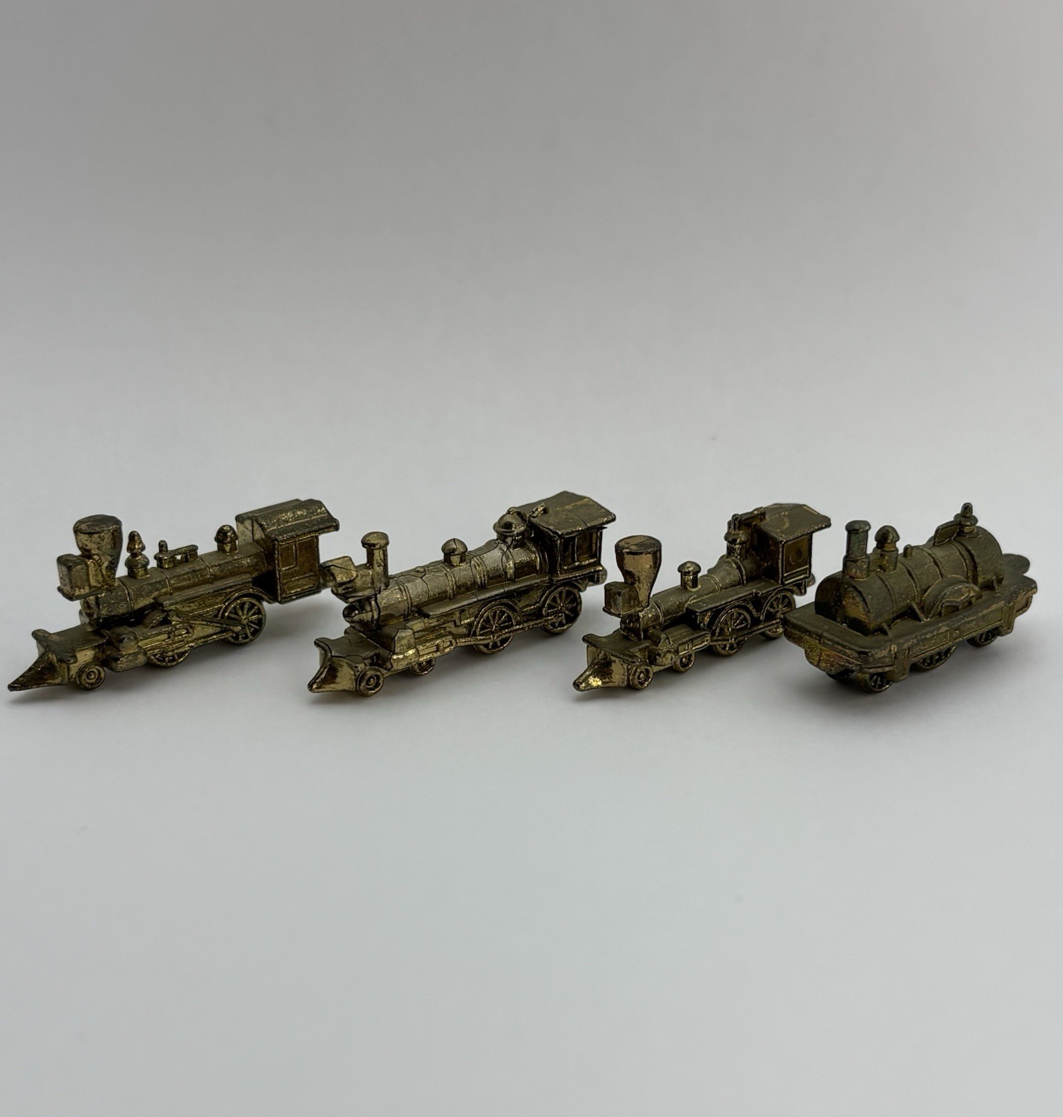 Vintage Miniature Gold Tone Pewter Locomotive Train Engine Hong Kong Lot Of 4