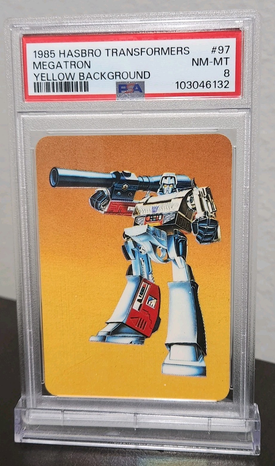 1985 Hasbro Transformers Megatron #97 PSA 8 Yellow Background G1 Card 1985 Hasbro Transformers Megatron #97 PSA 8 Yellow Background G1 Card