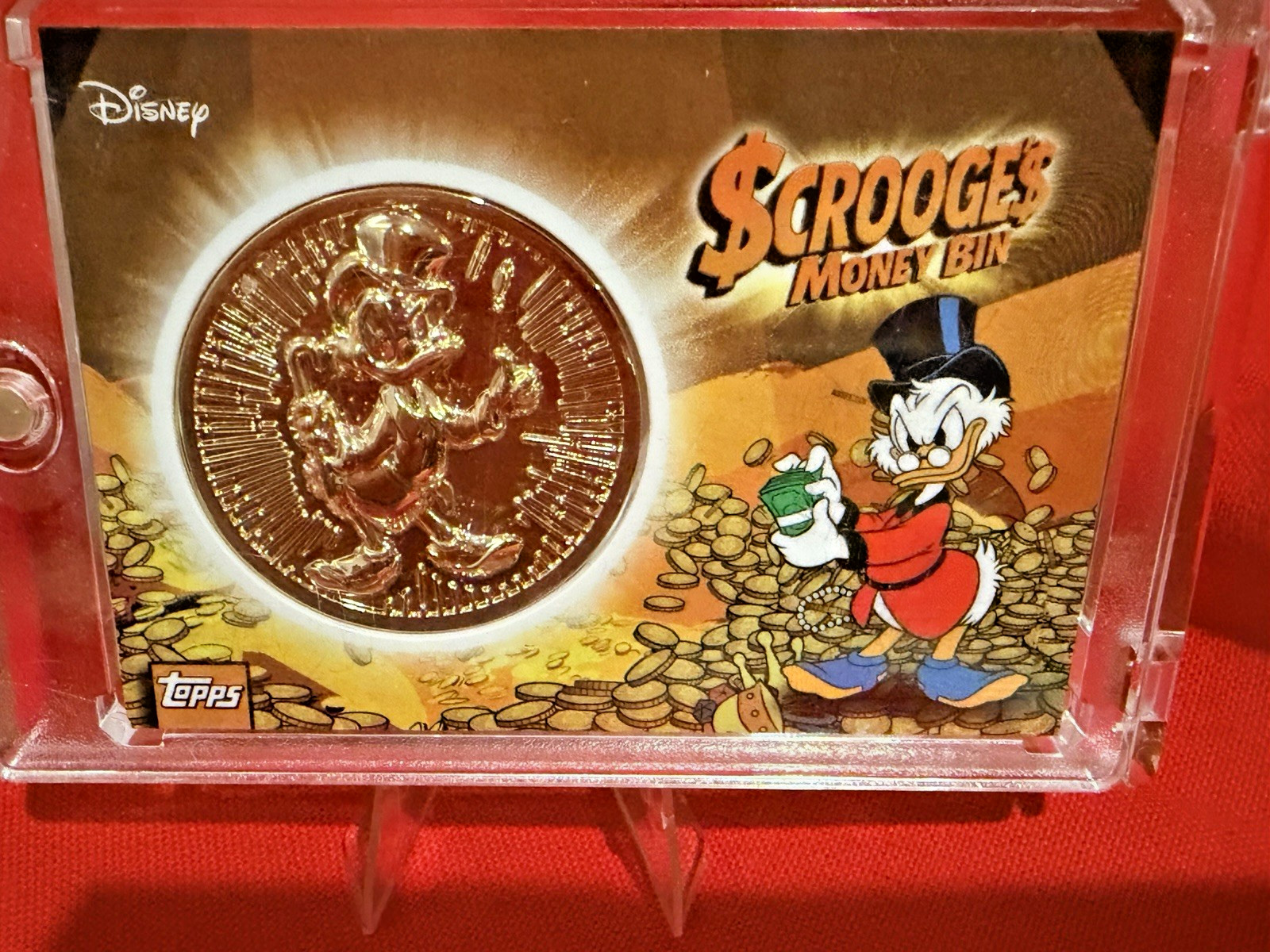 2026 Topps Disney Neon Scrooge McDuck Money Bin Coin Relic/Medallion in Holder 2026 Topps Disney Neon Scrooge McDuck Money Bin Coin Relic/Medallion in Holder