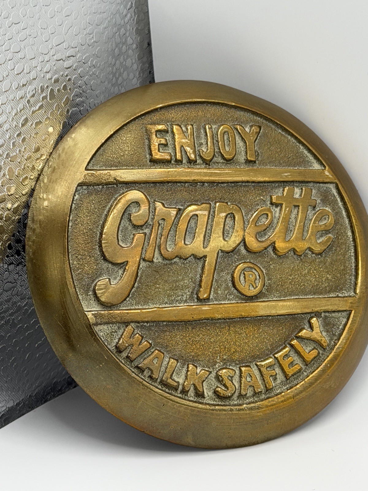 Vintage 1930s/40s Enjoy Grapette Soda Walk Safely Heavy Brass Sidewalk Marker