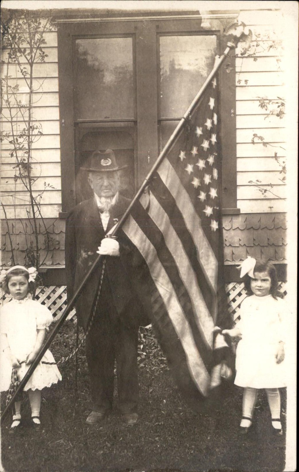 Civil War Veteran CHICKERING American flag and two girls c1910 RPPC bhn
