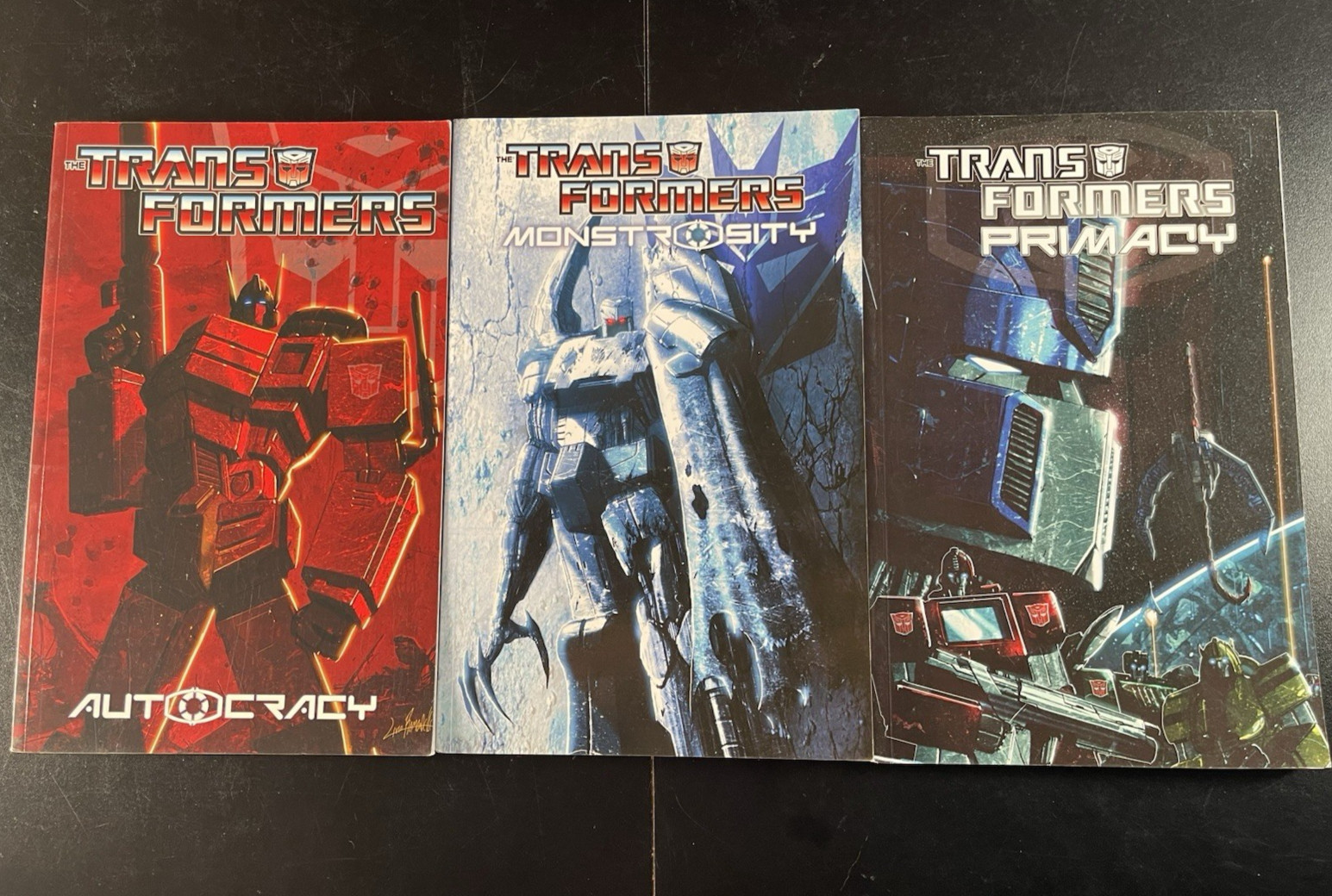 IDW Transformers LOT x 3 Trade Paperback Autocracy Monstrosity Primacy IDW Transformers LOT x 3 Trade Paperback Autocracy Monstrosity Primacy