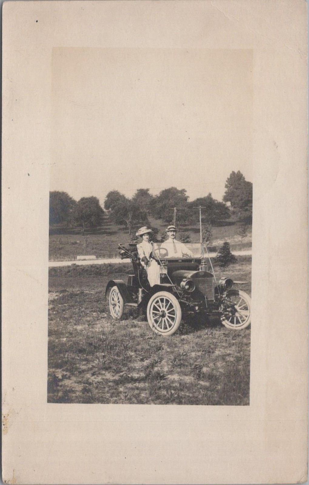 RPPC Postcard Couple Cruising in Antique Car Early 1900s 