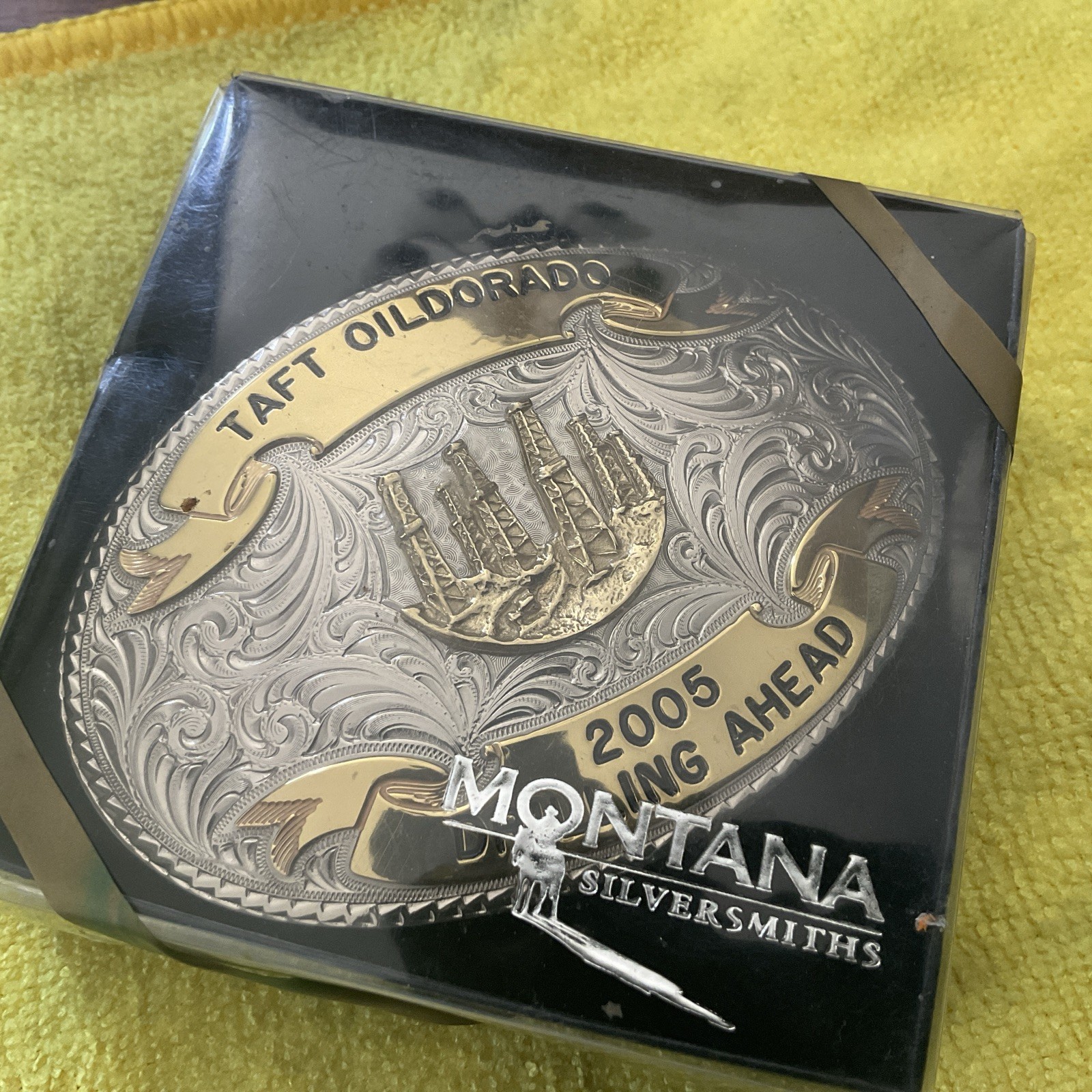 custom Montana Silversmiths belt buckle from 2005 featuring a custom Montana Silversmiths belt buckle from 2005 featuring a