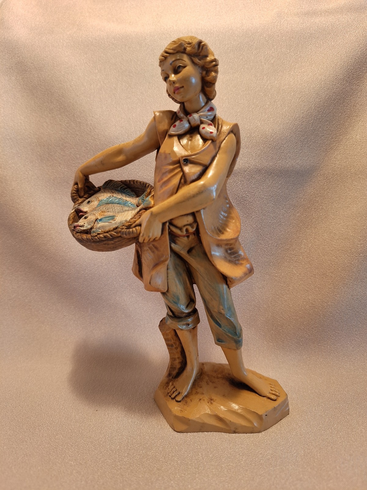 1986 Fontanini Figurine-Boy holding basket of fish #322 - 7.5 1986 Fontanini Figurine-Boy holding basket of fish #322 - 7.5