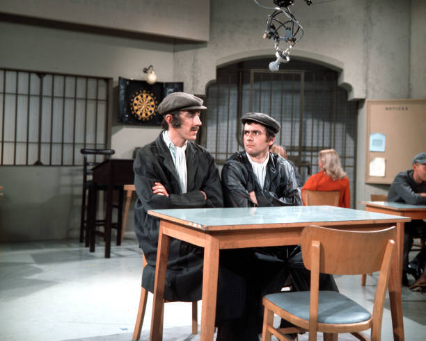 British actors and comedians Peter Cook and Dudley Moore are dres- Old Photo British actors and comedians Peter Cook and Dudley Moore are dres- Old Photo