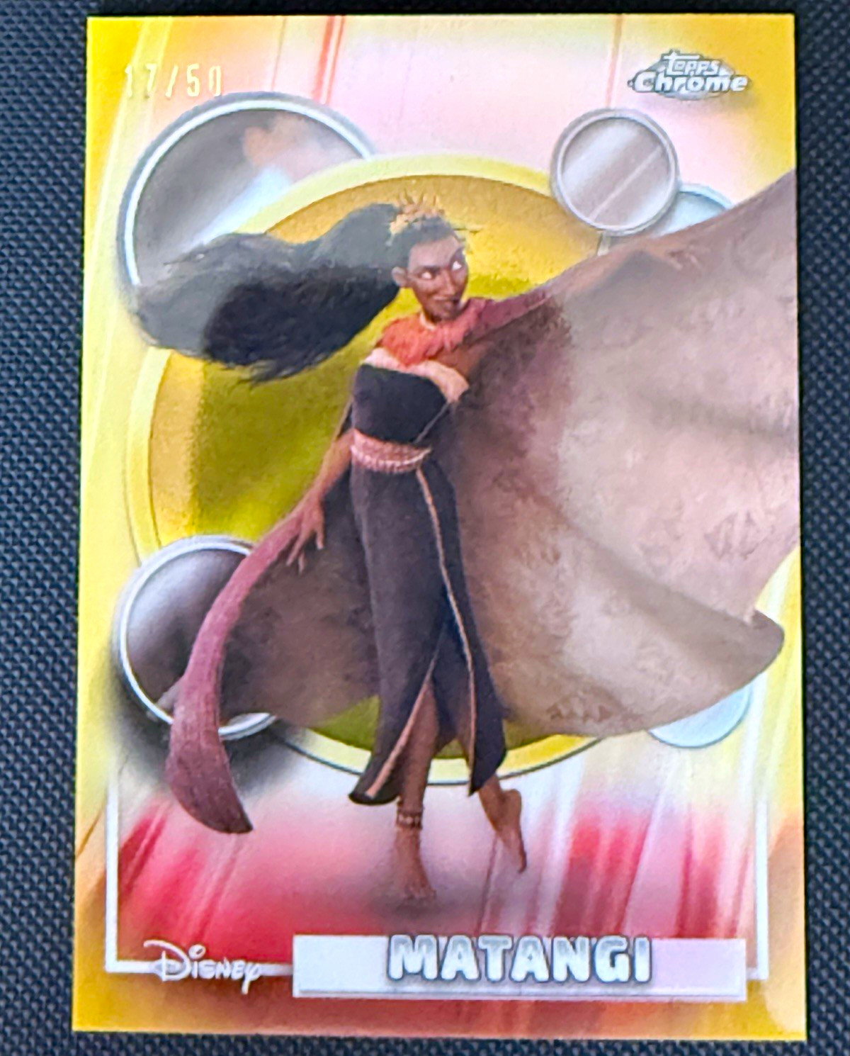 Topps 2026 Topps Chrome Disney Moana Matangi #12 Gold Numbered 17/50 Topps 2026 Topps Chrome Disney Moana Matangi #12 Gold Numbered 17/50
