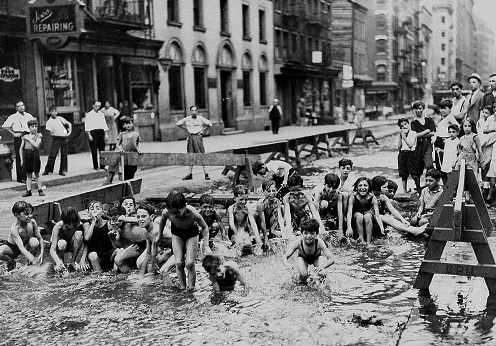 New York City photo Mulberry St Ghetto Kids Cooling off in Muddy street 1920