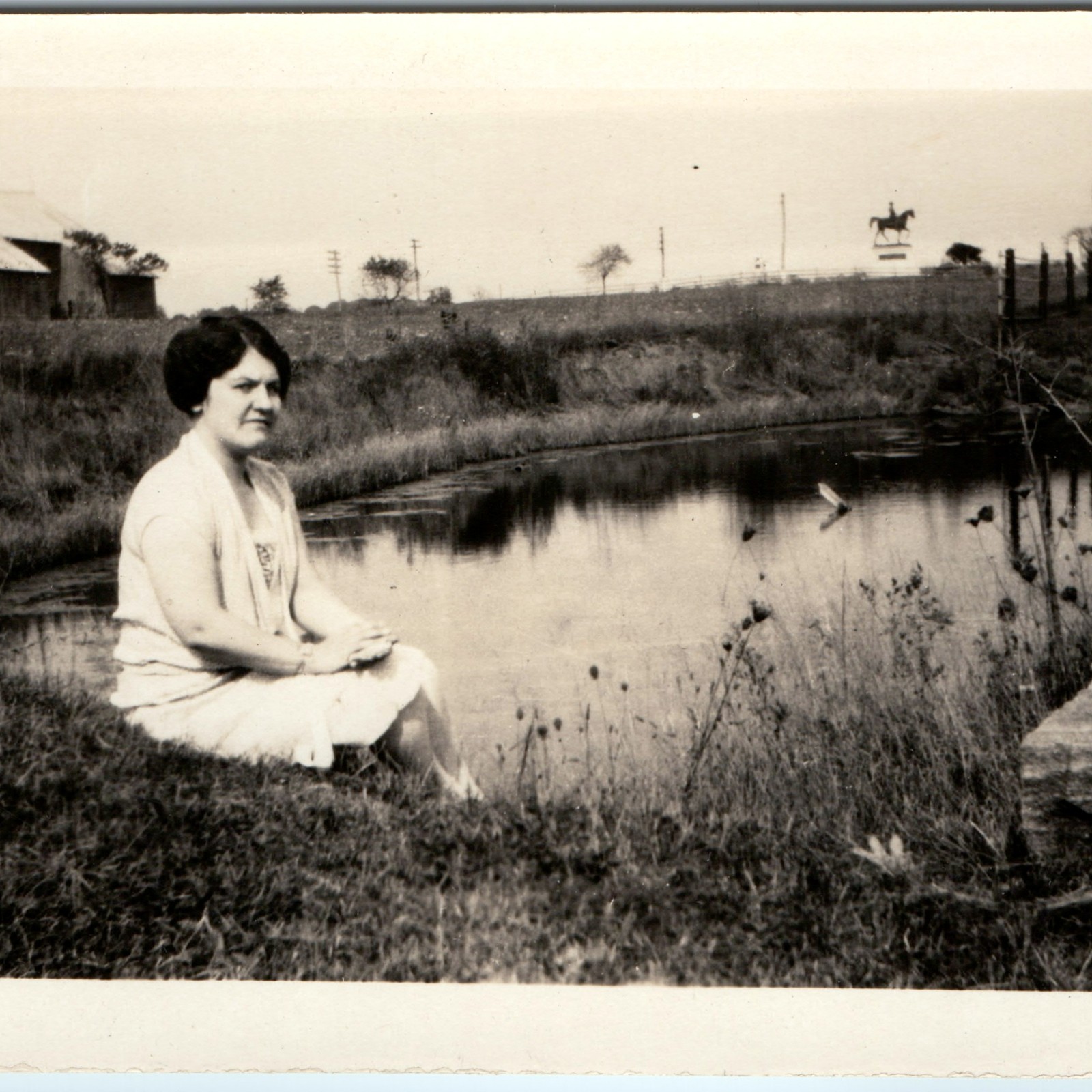 c1920s Woman Sitting Farm Pond Snapshot Photo Barn Horse Statue Rural Nostalgic c1920s Woman Sitting Farm Pond Snapshot Photo Barn Horse Statue Rural Nostalgic