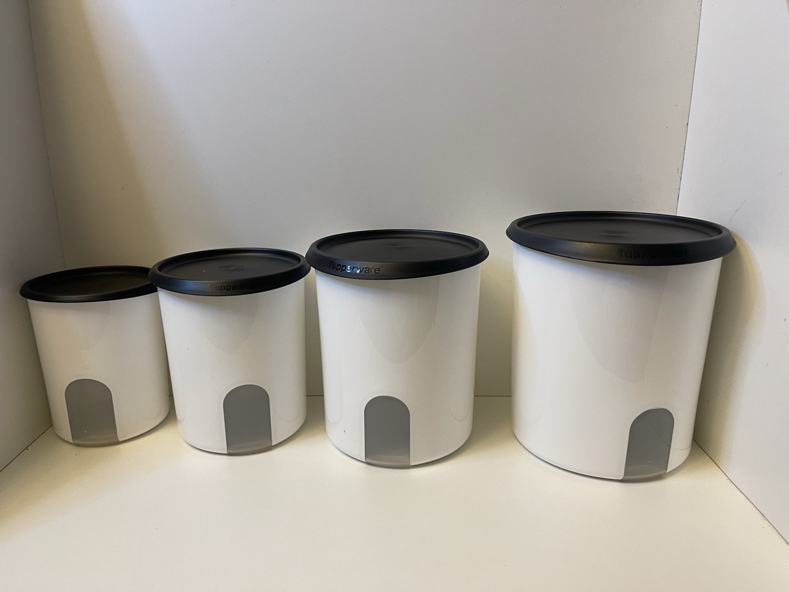 Tupperware NEW One-Touch Reminder Canister Set of 4with black seals Tupperware NEW One-Touch Reminder Canister Set of 4with black seals