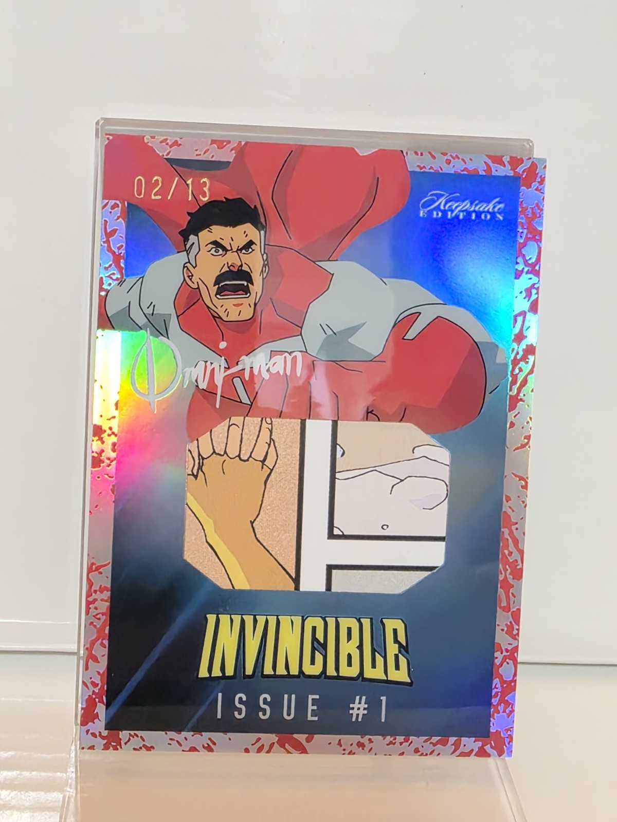 Invincible Keepsake Holo Blood Splatter Issue #1 - 2/13 Omni-Man Ultra Grail Invincible Keepsake Holo Blood Splatter Issue #1 - 2/13 Omni-Man Ultra Grail