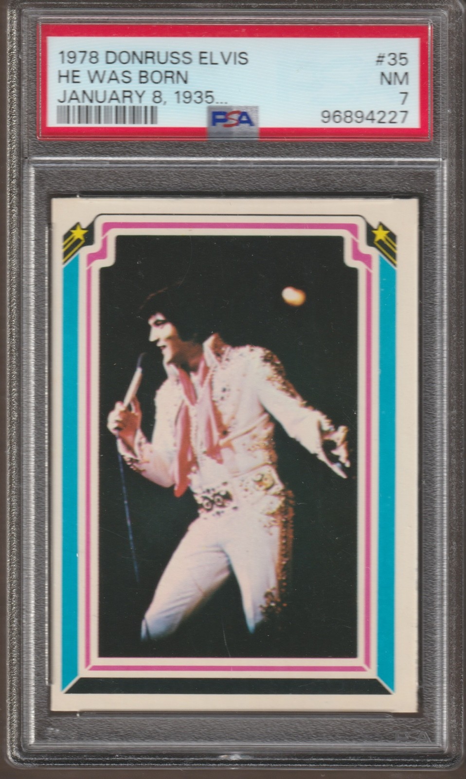 1978 DONRUSS ELVIS PRESLEY FACTS CARD #35 - PSA 7 - HE WAS BORN JANUARY 8, 1935 1978 DONRUSS ELVIS PRESLEY FACTS CARD #35 - PSA 7 - HE WAS BORN JANUARY 8, 1935