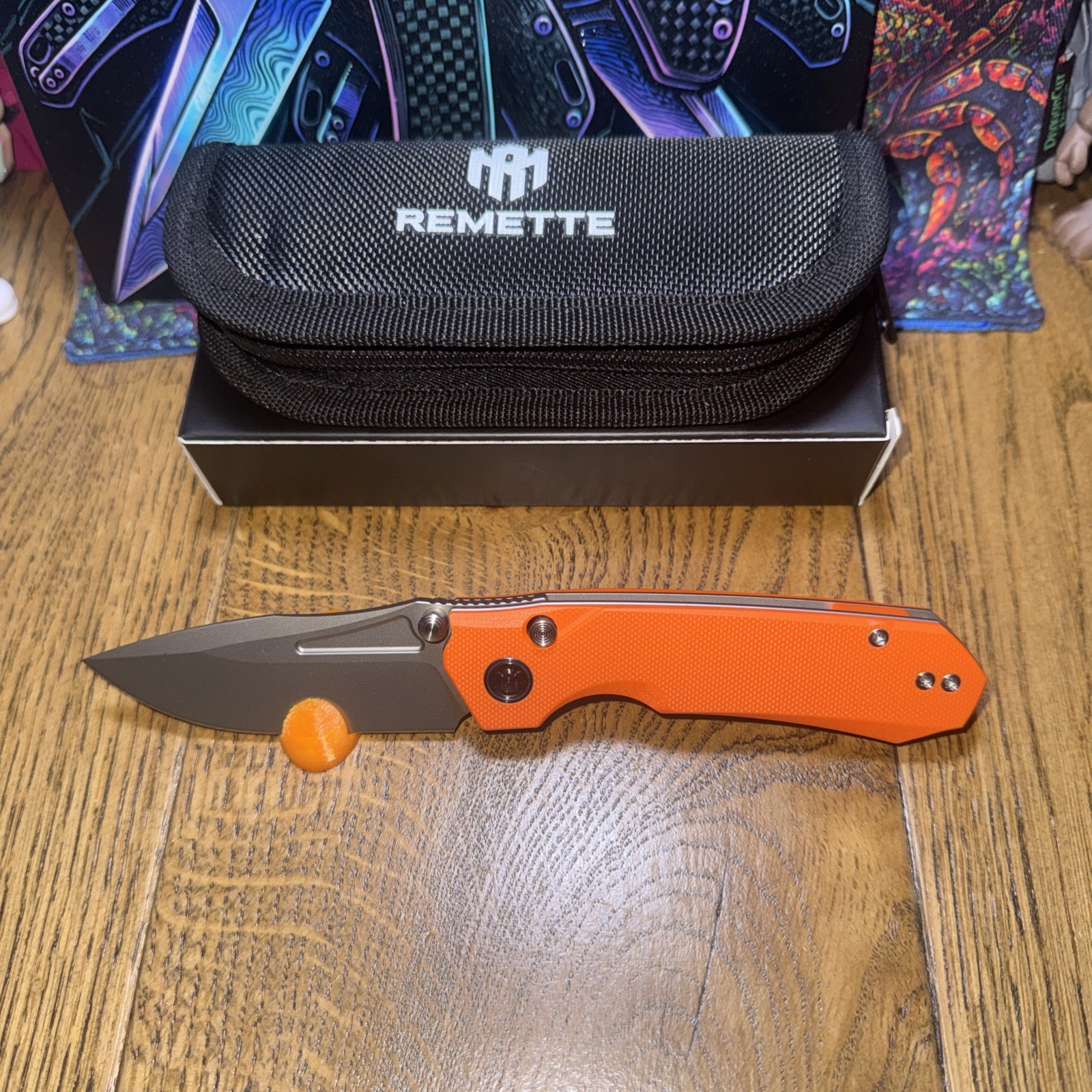 REMETTE RT-Rhino Orange RNGD3 G10 Scales. D2 Blade. Button/liner Lock Thumb Stud