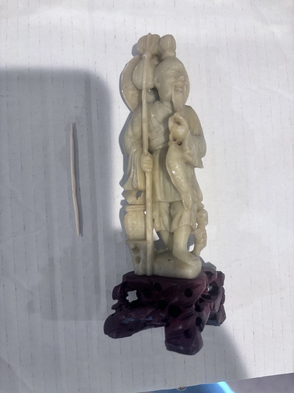 Hand Carved Soapstone Of Man And Fish Hand Carved Soapstone Of Man And Fish
