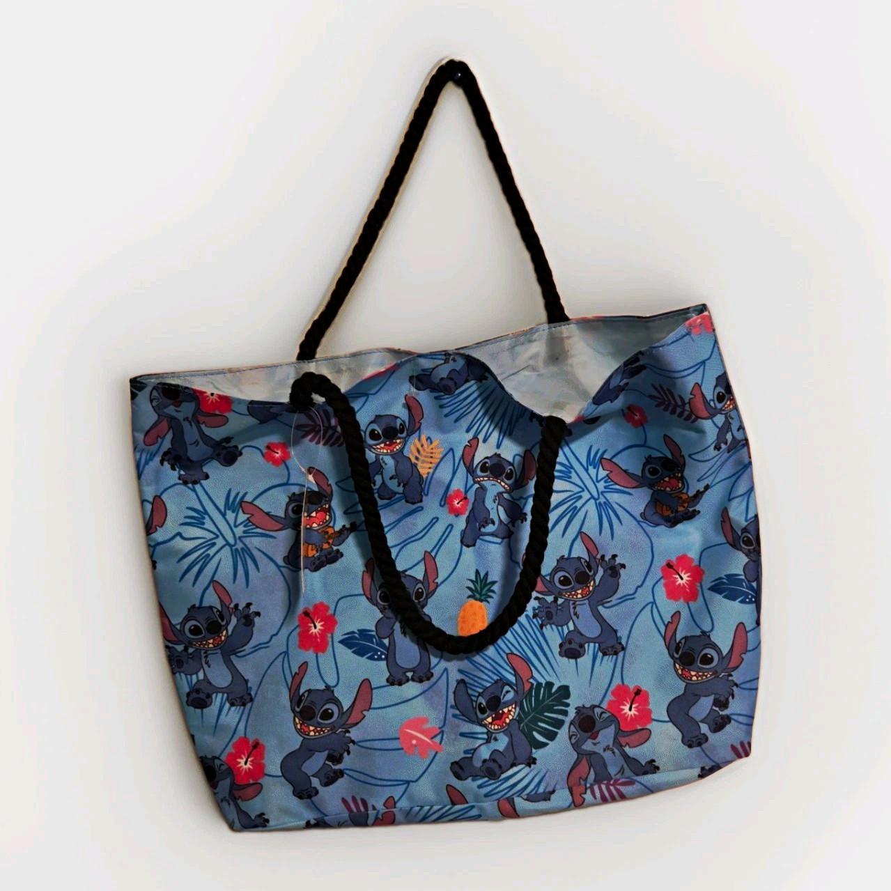Disney Stitch Large Blue Tropical Floral Tote Bag w/ Black Rope Handles 2023 NWT Disney Stitch Large Blue Tropical Floral Tote Bag w/ Black Rope Handles 2023 NWT