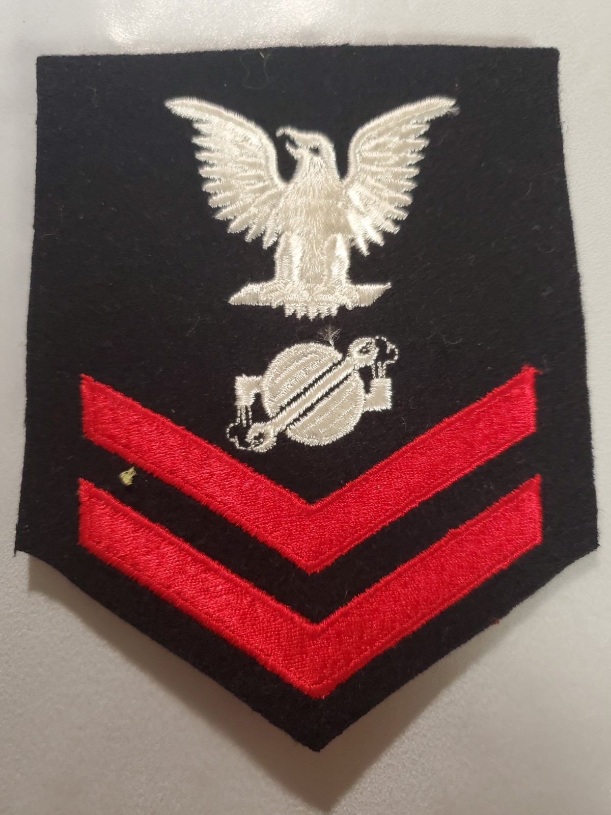 WWll Era U.S. Navy Rating Badge for a Machinist\'s Mate Second Class (MM2) WWll Era U.S. Navy Rating Badge for a Machinist\'s Mate Second Class (MM2)
