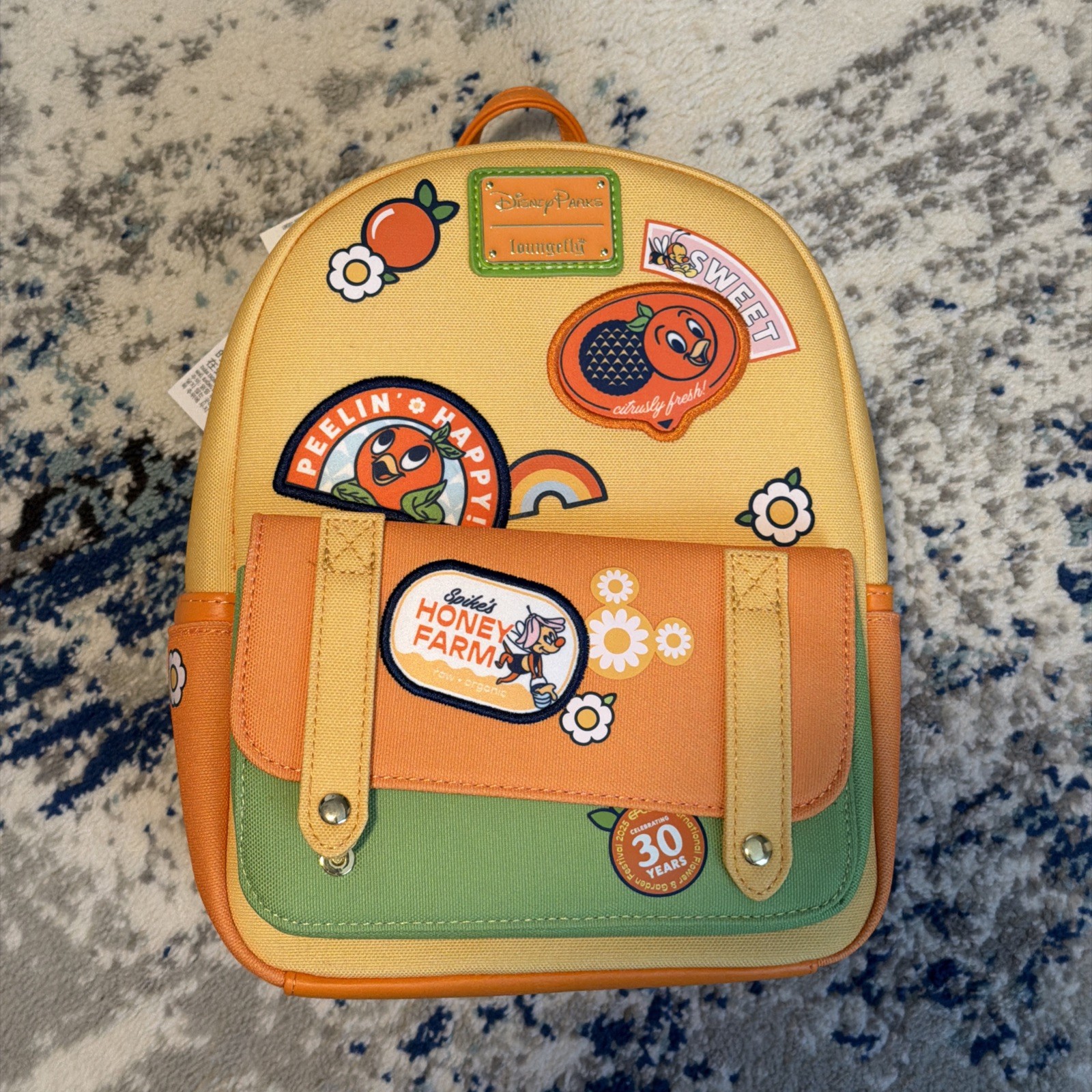 Loungefly Disney EPCOT 30th Orange Bird Flower & Garden Festival Mini Backpack Loungefly Disney EPCOT 30th Orange Bird Flower & Garden Festival Mini Backpack