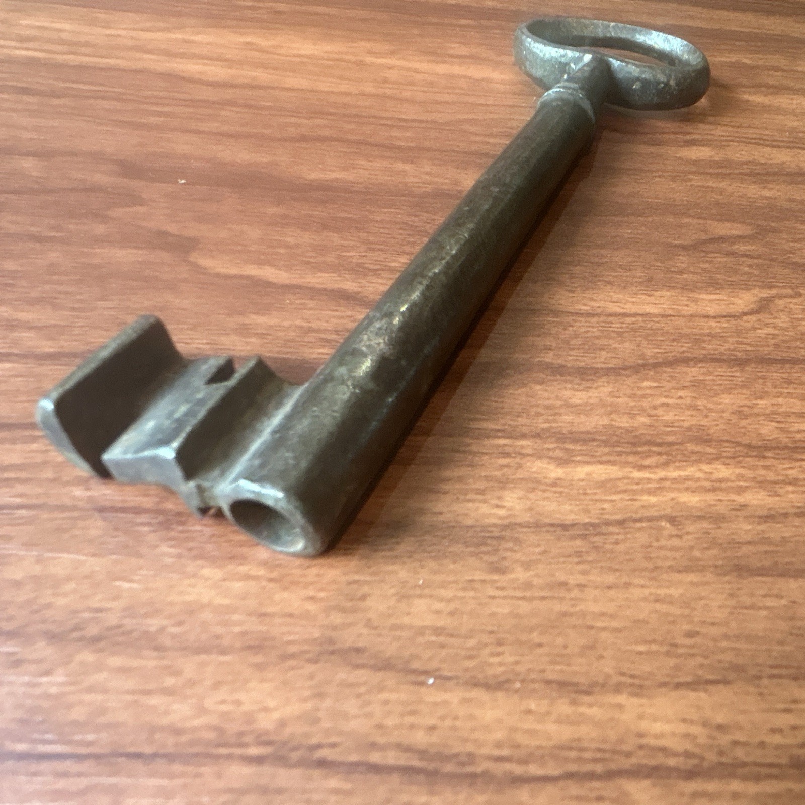 Large antique metal skeleton key with oval bow, old-style vintage key
