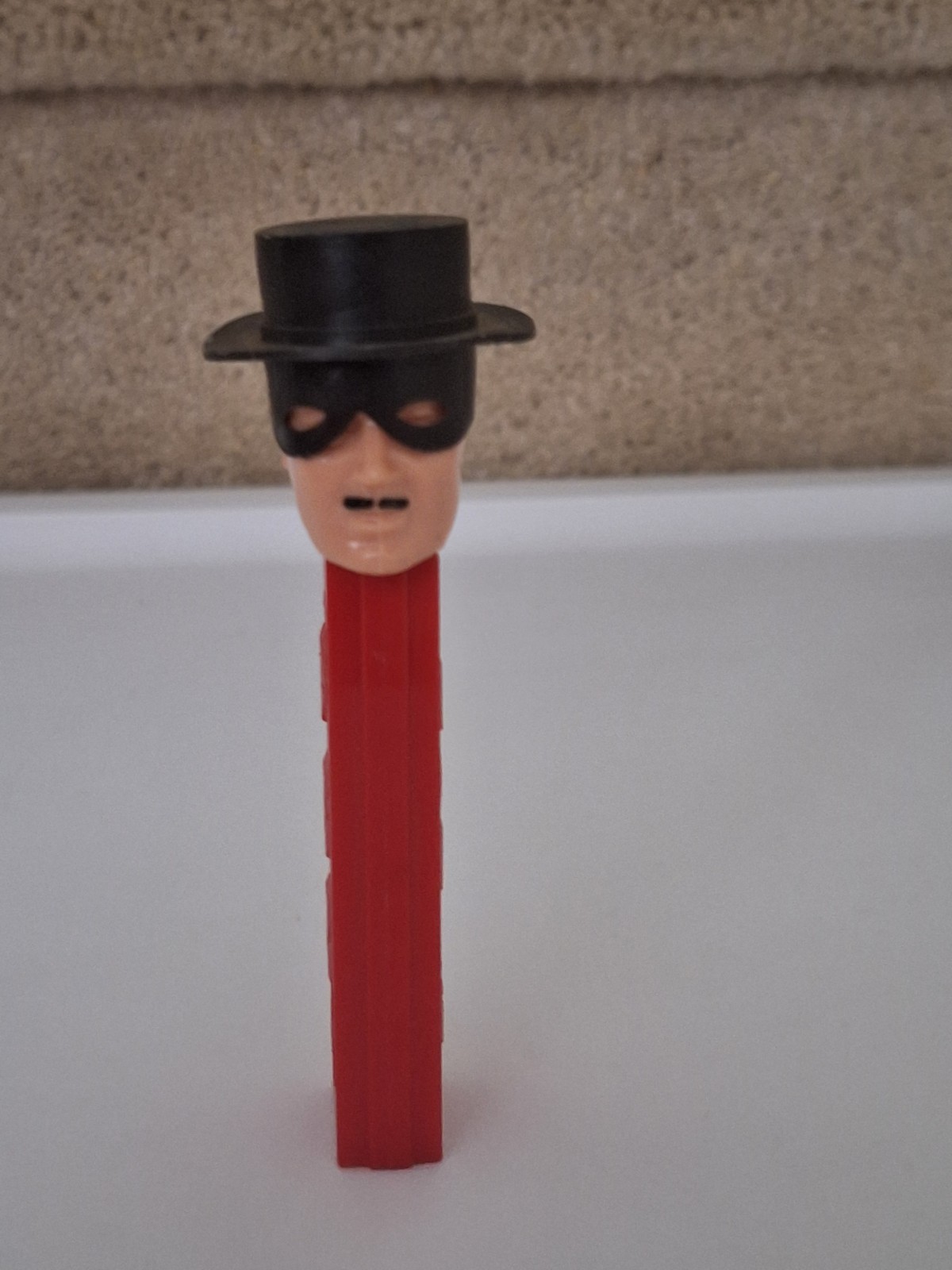 Vintage 1965 No Feet Zorro PEZ Dispenser with Curved Mask, Red Stem, Austria Vintage 1965 No Feet Zorro PEZ Dispenser with Curved Mask, Red Stem, Austria
