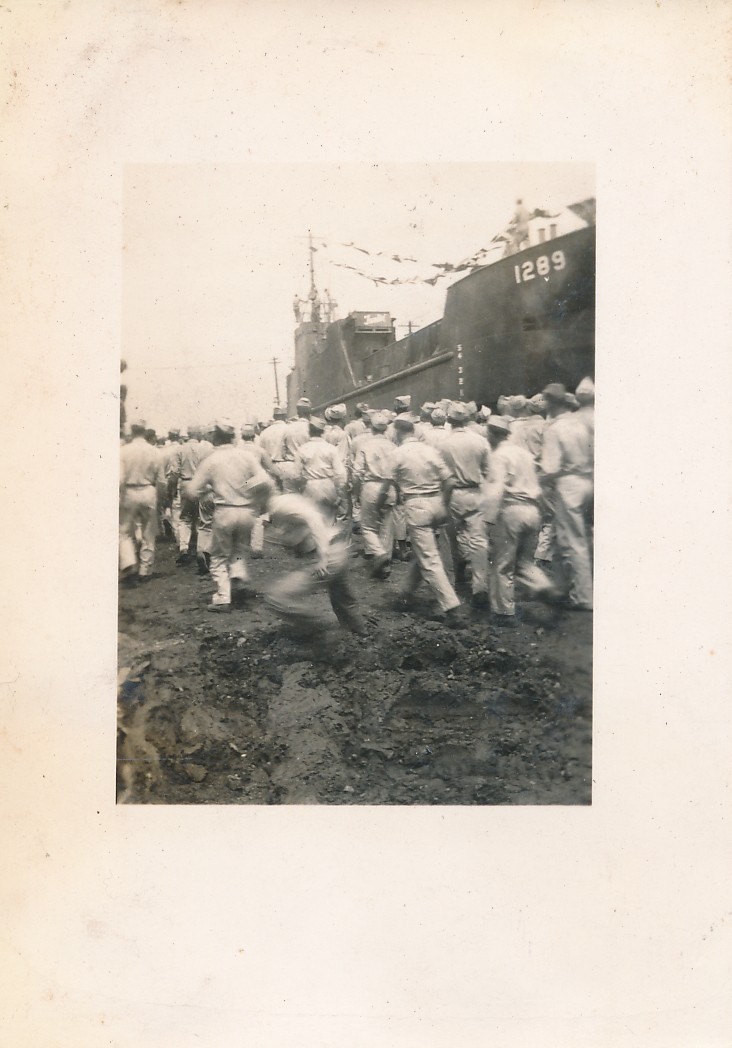 Blurred Army Man Running in Wrong Direction as Troops WW2 vintage snapshot photo