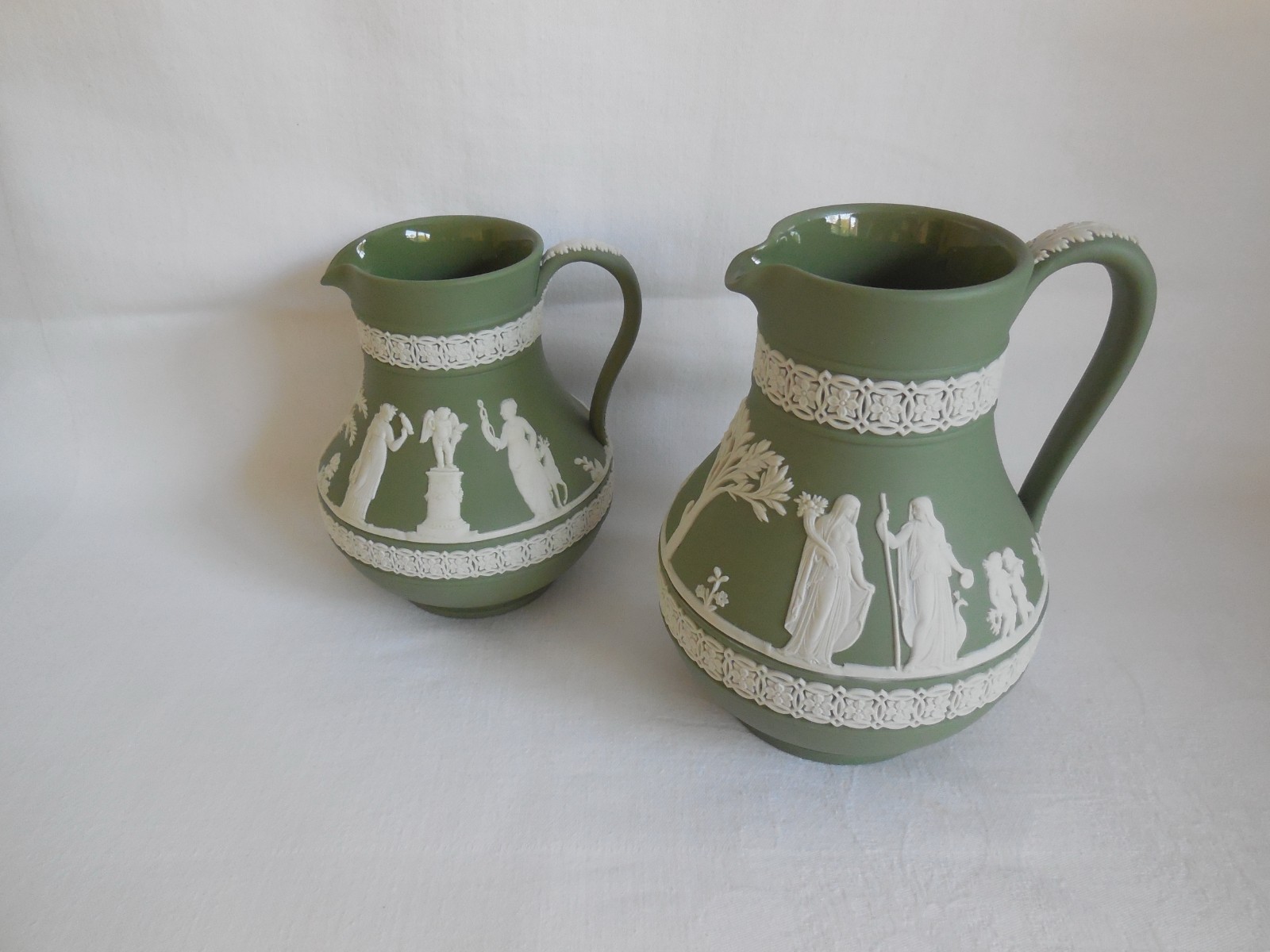 Two Wedgwood Sage Green Jasperware Etruscan Jugs Two Wedgwood Sage Green Jasperware Etruscan Jugs