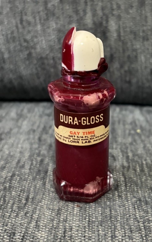 vintage mid-20th-century Dura-Gloss nail polish bottle in the shade \