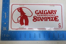 NOS FLAT CALGARY ALBERTA EXHIBITION STAMPEDE METAL BOOSTER LICENSE PLATE (BB1 picture