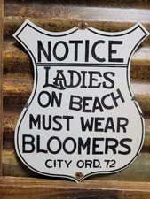 VINTAGE NUDE BEACH PORCELAIN SIGN OLD NOTICE LADIES MUST WEAR BLOOMERS SHIELD picture