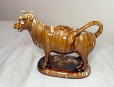 Rare Early Antique Staffordshire pottery brown drip Glaze Cow Creamer Sculpture. picture