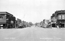 1950 Brookings South Dakota Main Street autos RPPC Postcard 25-8019 picture