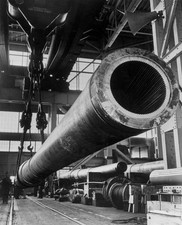 View down barrel of a 16 rifle cannon suspended by cables inside a - Old Photo picture