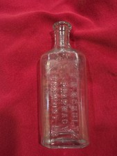 Vintage J H Schultz  Pharmacy  Tremont Pa Embossed Clear Glass Medicine Bottle picture