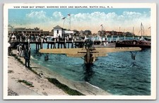 1932 Watch Hill RI View from Bay Street Showing Dock and Seaplane Postcard picture