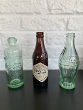 1899, 1900, & 1915 Coca-Cola Bottles. 100 Centennial Celebration 1986 picture
