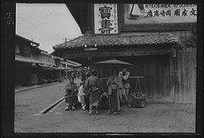Photo:Japan 1908 street scene crowds shop signs buildings picture