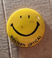 vintage yellow smiley face pinback button custom-printed for Western Optical picture