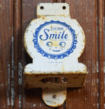 SMILE ORANGE SODA STAMPED PAINTED METAL BOTTLE OPENER SIGN VINTAGE 1950s SUN CAP picture