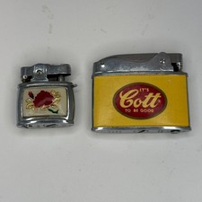 Lot of 2 Vintage Penguin Japan Lighters Cott Soda Advertising Rose Enamel picture