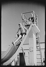 Photo:Greenbelt Maryland 1939 Boys Sliding into Pool Swim Tower FSA Photo picture