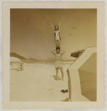 FOUND PHOTO - Couple in swimwear at beach, girl on shoulders of hunky man 1950s picture