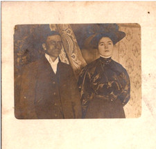 Severe Looking Man & Woman in Flower Hat Photo Portrait 1900s RPPC Postcard picture