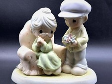 Precious Moments Figurine - Caring Man with Flowers. picture