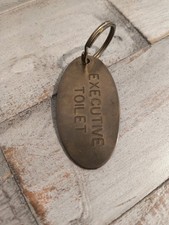 Rare 1976 “Executive Toilet” Brass Keychain Lowell Sigmund Novelty  picture
