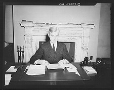 Photo:Man Writing at Desk Fireplace 1935-1945 Black and White Portrait picture