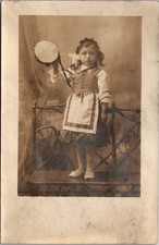 Postcard Real Photo RPPC Young Girl Valentina Standing on Bench with Tambourine picture