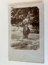 Young Man working Outside with Big Rocks RPPC Postcard picture
