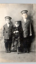 BOYS IN OFFICER HATS c1910 posstcard real photo rppc unusual portrait pose picture